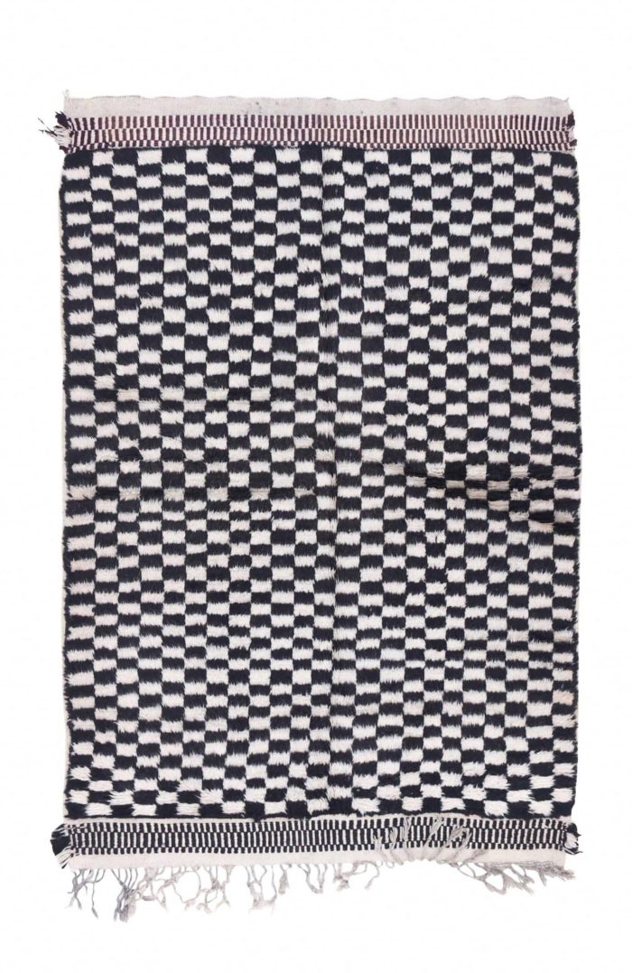 Black checkered outdoor rug for Moroccan rugs on a sunny patio