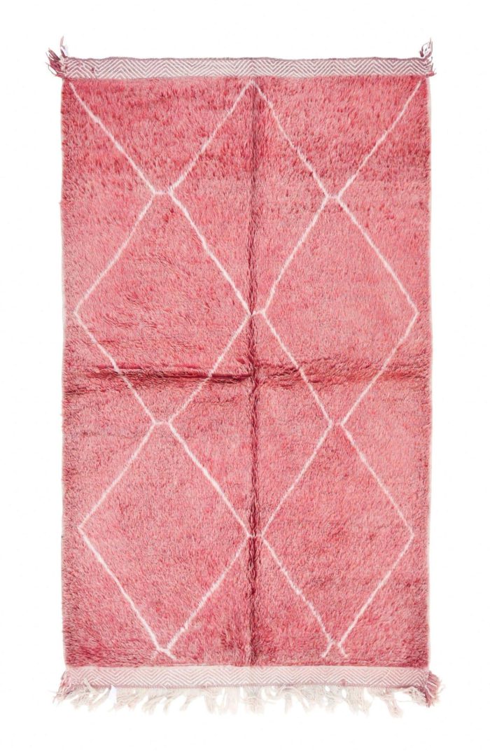 Pink Moroccan rug with Berber patterns for home decor.