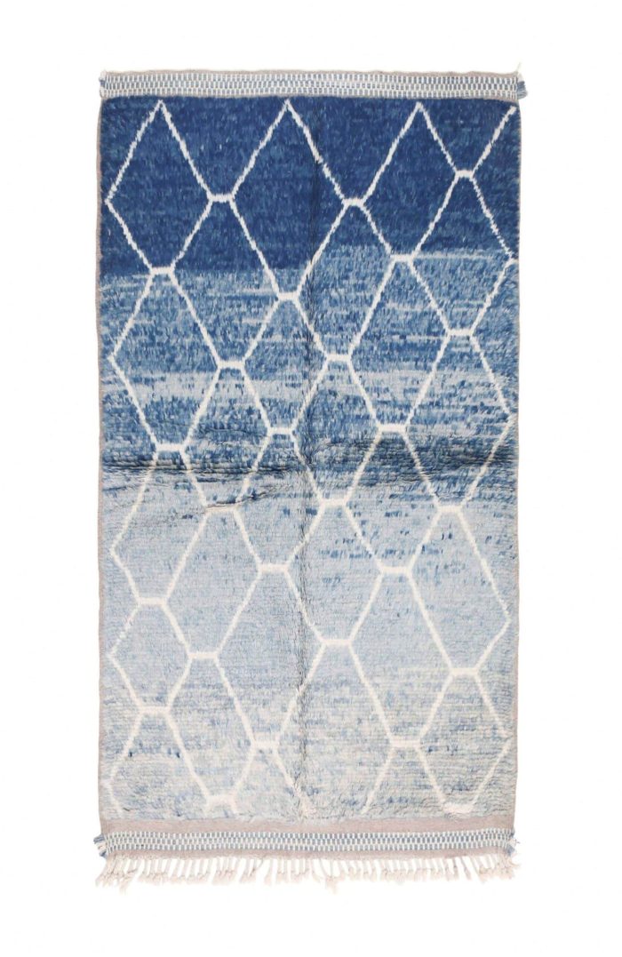 Taznakhet-blue abstract rug with handcrafted Moroccan patterns.