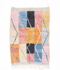 Abstract area rug featuring vibrant colors and artistic patterns