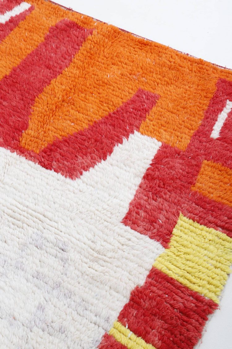 Luxurious Moroccan abstract art area rug with bold patterns and vibrant colors.