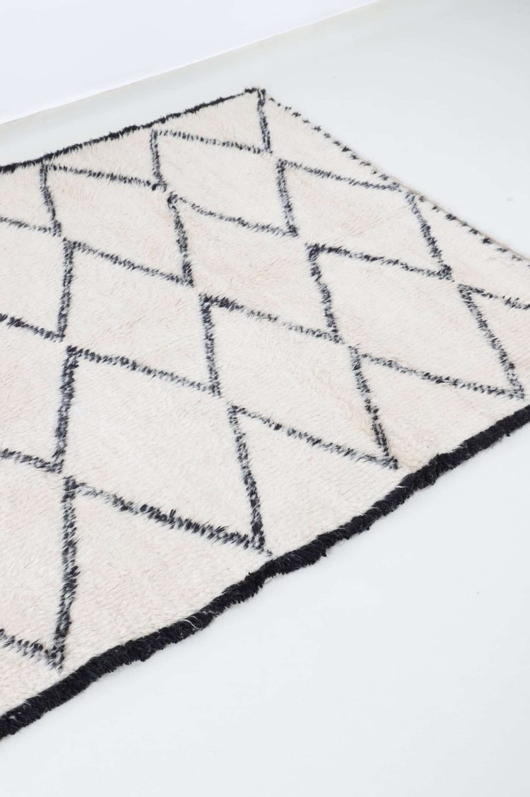 Luxurious handwoven Moroccan Beni Ourain Rug with black-and-white geometric patterns