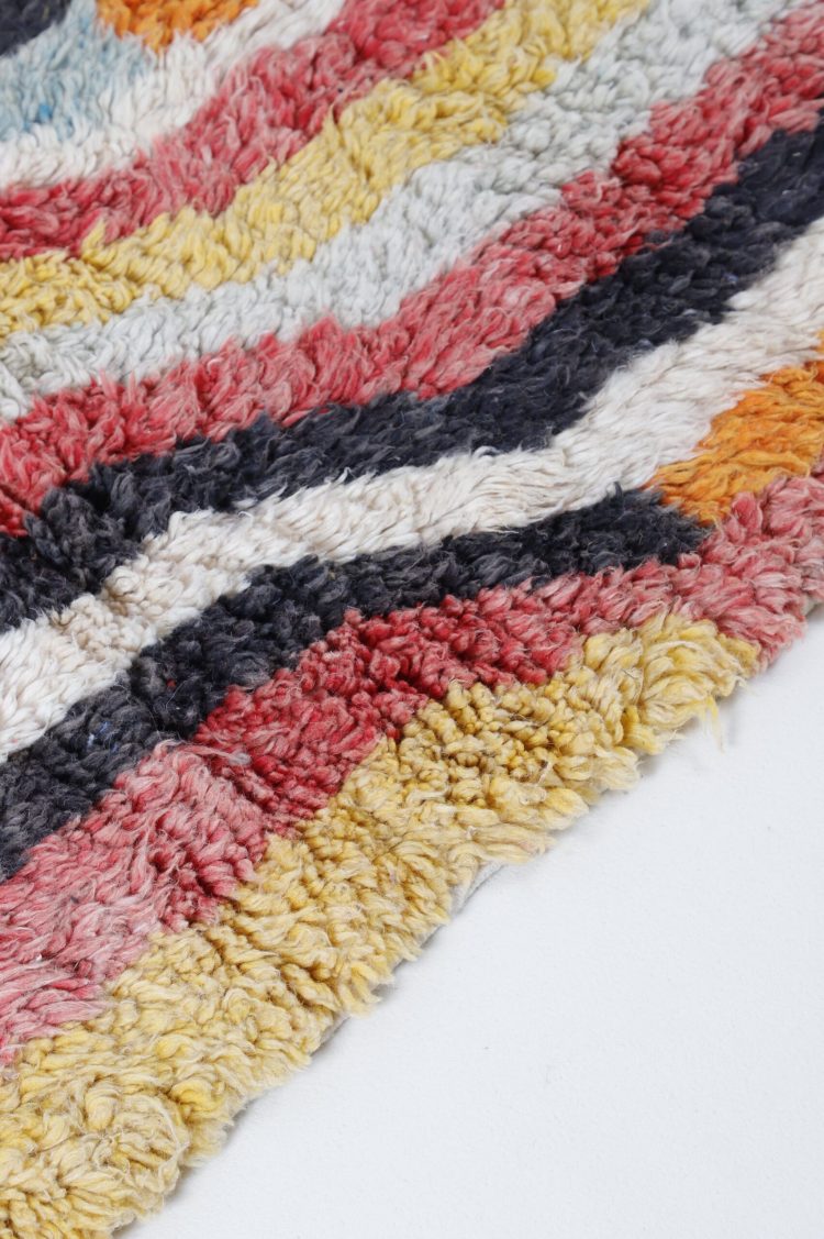 Handwoven Abstract Moroccan Rug with vibrant colors and intricate patterns.