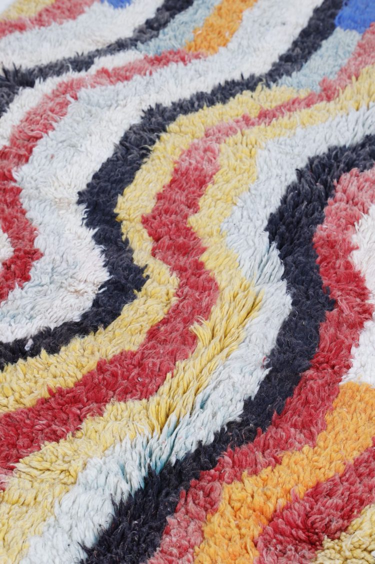 Handwoven Abstract Moroccan Rug with vibrant colors and intricate patterns.