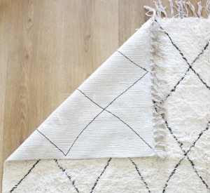 Traditional handwoven Berber rug in neutral tones