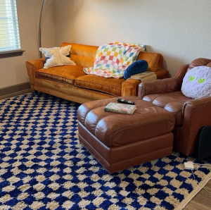 Colorful checkered outdoor rug in a poolside setting