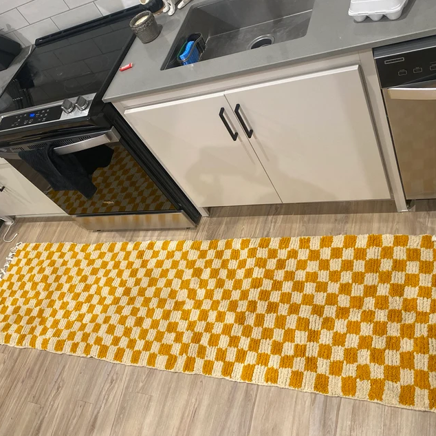 Small checkered rugs in a porch entryway