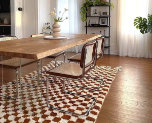 Soft yellow checkered rug in a light and airy bedroom