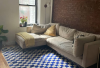 Blue checkered rug in a modern living room.