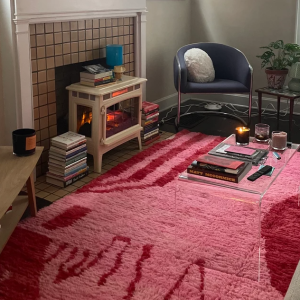 Handwoven Moroccan Boujad rug in vibrant red and orange hues