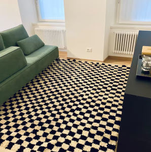 Traditional Beni Ourain checkered rug on hardwood floor