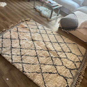 Flatweave Zanafi Moroccan Berber rug in a minimalist workspace.