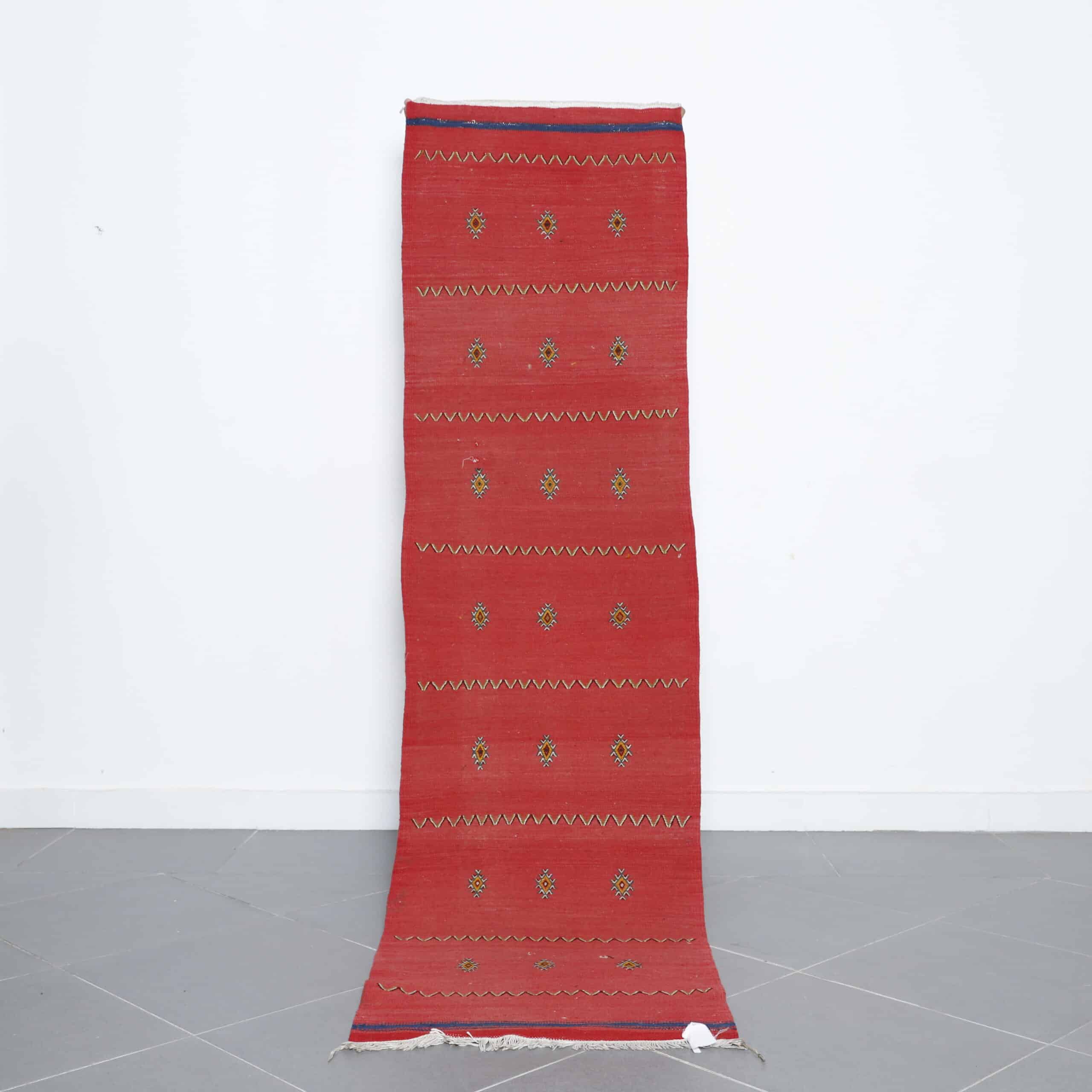 Akhnif runner rug 8.2×2.2 ft handmade Moroccan wool rug in red with embroidered Berber motifs