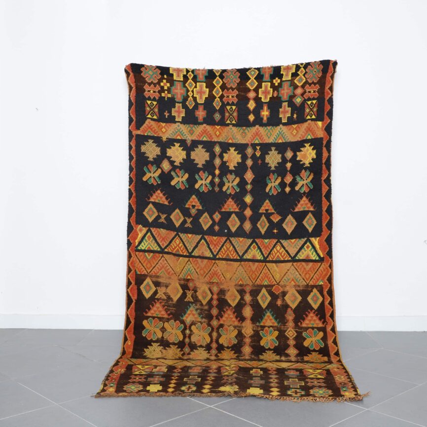 Handmade Moroccan Berber Rug with intricate geometric motifs in earthy tones